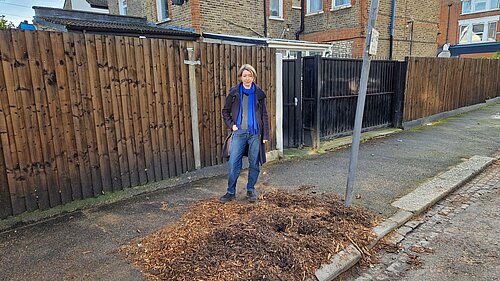Naomi McCarthy next to a removed street tree