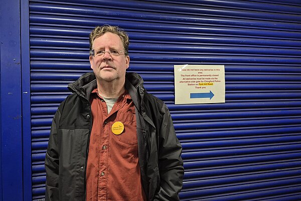 Lib Dem candidate Arran Angus outside the closed front desk at Chingford Police Station