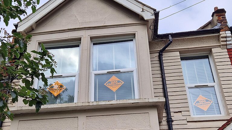 Liberal Democrat posters in the window of a house